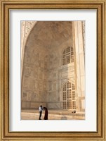 Framed Visitors dwarfed by the Taj Mahal, Agra, Uttar Pradesh, India