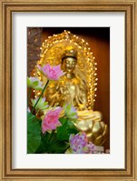 Framed Pink lotus flowers in front of gold statue, Kek Lok Si Temple, Island of Penang, Malaysia