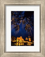 Framed Sultan Abdul Samad Building across from Independance Square outlined in lights at night in Kuala Lumpur Malaysia