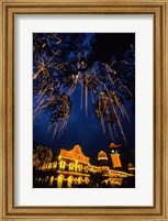 Framed Sultan Abdul Samad Building across from Independance Square outlined in lights at night in Kuala Lumpur Malaysia