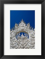 Framed new all white temple of Wat Rong Khun in Tambon Pa O Don Chai designed by Chalermchai Kositpipat.