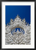 Framed new all white temple of Wat Rong Khun in Tambon Pa O Don Chai designed by Chalermchai Kositpipat.