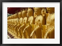 Framed Taiwan, Foukuangshan Temple, Standing gold-colored Buddha statues at a Buddhist shrine