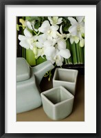 Framed Traditional Thai tea pot and cups with orchid arrangement, Bangkok, Thailand