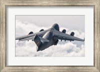 Framed C-17 Globemaster Above the Clouds
