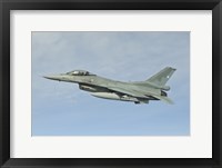 Framed Chilean Air Force F-16 soars through the sky over Brazil