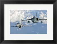 Framed Dassault Rafale of the French Air Force and an Embraer A-1B of the Brazilian Air Force