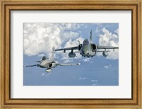 Framed Dassault Rafale of the French Air Force and an Embraer A-1B of the Brazilian Air Force