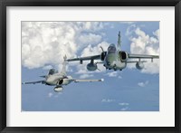 Framed Dassault Rafale of the French Air Force and an Embraer A-1B of the Brazilian Air Force