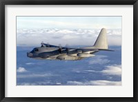 Framed MC-130P Combat Shadow Soars Above the Clouds