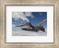 Framed F-16 Fighting Falcon flies with AGM-65 Maverick