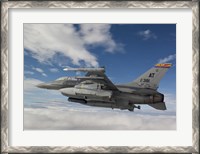 Framed F-16 Fighting Falcon flies with AGM-65 Maverick