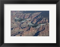 Framed F-16's fly in formation near the Grand Canyon, Arizona