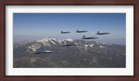 Framed F-22 Raptors Over New Mexico Mountains