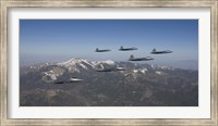 Framed F-22 Raptors Over New Mexico Mountains