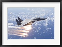 Framed F-15 Eagle Releases Flares over the Pacific Ocean