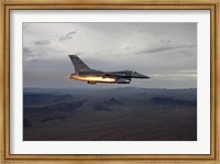Framed F-16 Fighting Falcon Fires an AGM-65 Maverick Missile