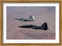 Framed F-22 Raptor and T-38 Talon Fly in Formation over New Mexico