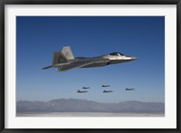 Framed F-22 Raptors Fly in Formation Over New Mexico