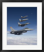 Framed Four F-16's Fly in Formation During a Training Mission