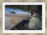 Framed Loadmaster on an HC-130 Watches a HH-60G Pave Hawk Refuel