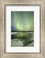 Framed Aurora Borealis over a creek, Yukon, Canada