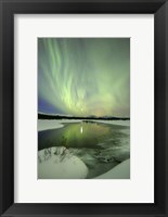 Framed Aurora Borealis over a creek, Yukon, Canada