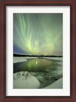 Framed Aurora Borealis over a creek, Yukon, Canada