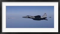 Framed F-15 Eagle Fires an AIM-9 Missile
