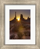 Framed Sunburst through the Totem Polein Monument Valley, Utah