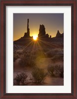 Framed Sunburst through the Totem Polein Monument Valley, Utah