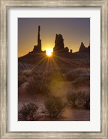 Framed Sunburst through the Totem Polein Monument Valley, Utah