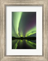 Framed Aurora borealis over Fish lake, Whitehorse, Yukon, Canada (vertical)
