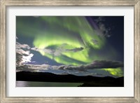 Framed Aurora borealis over Fish Lake, Yukon, Canada