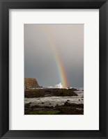 Framed New Zealand, South Island A rainbow arcs over Curio Bay