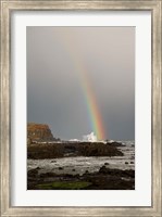 Framed New Zealand, South Island A rainbow arcs over Curio Bay