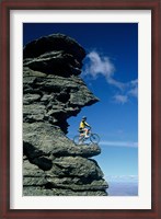 Framed Mountain Biker and Rock Tor, Dunstan Mountains, Central Otago