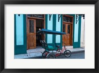 Framed Cuba, Camaquey, bike carriage and buildings
