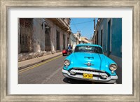 Framed Cuba, Camaquey, Oldsmobile car and buildings