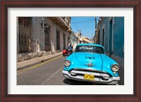Framed Cuba, Camaquey, Oldsmobile car and buildings