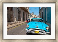 Framed Cuba, Camaquey, Oldsmobile car and buildings