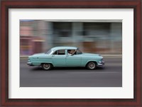 Framed 1950's era car in motion, Havana, Cuba