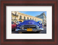 Framed 1950's era car parked on street in Havana Cuba