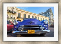 Framed 1950's era car parked on street in Havana Cuba