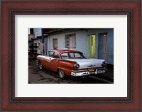 Framed 1950's era Ford Fairlane and colorful buildings, Trinidad, Cuba