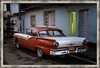 Framed 1950's era Ford Fairlane and colorful buildings, Trinidad, Cuba