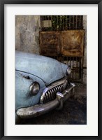 Framed Front of 1950's era car in front of gate, Havana, Cuba
