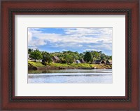 Framed Houses along a riverbank in the Amazon basin, Peru