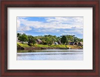 Framed Houses along a riverbank in the Amazon basin, Peru