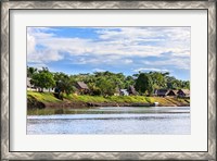 Framed Houses along a riverbank in the Amazon basin, Peru